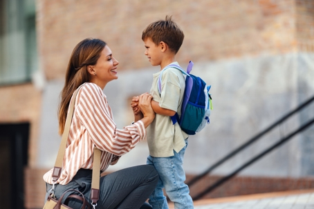 mother dropping off son at school