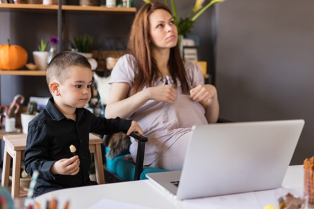 mother with her cute boy in the living room